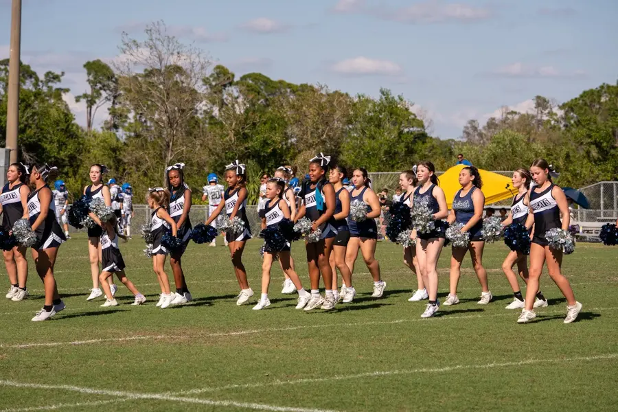 Bobcats cheerleaders performing on the sideline