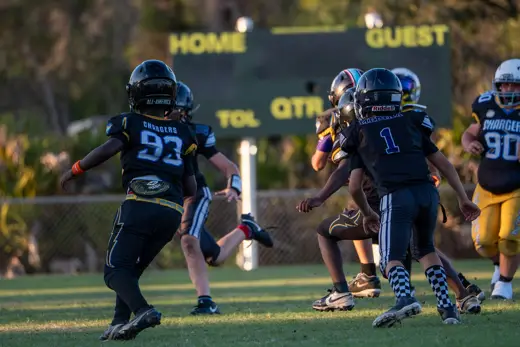 10U Bobcats ball carrier racing toward the end zone