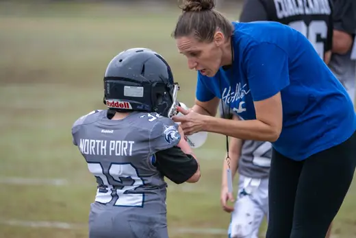 6U Bobcat getting a water break from a team mom